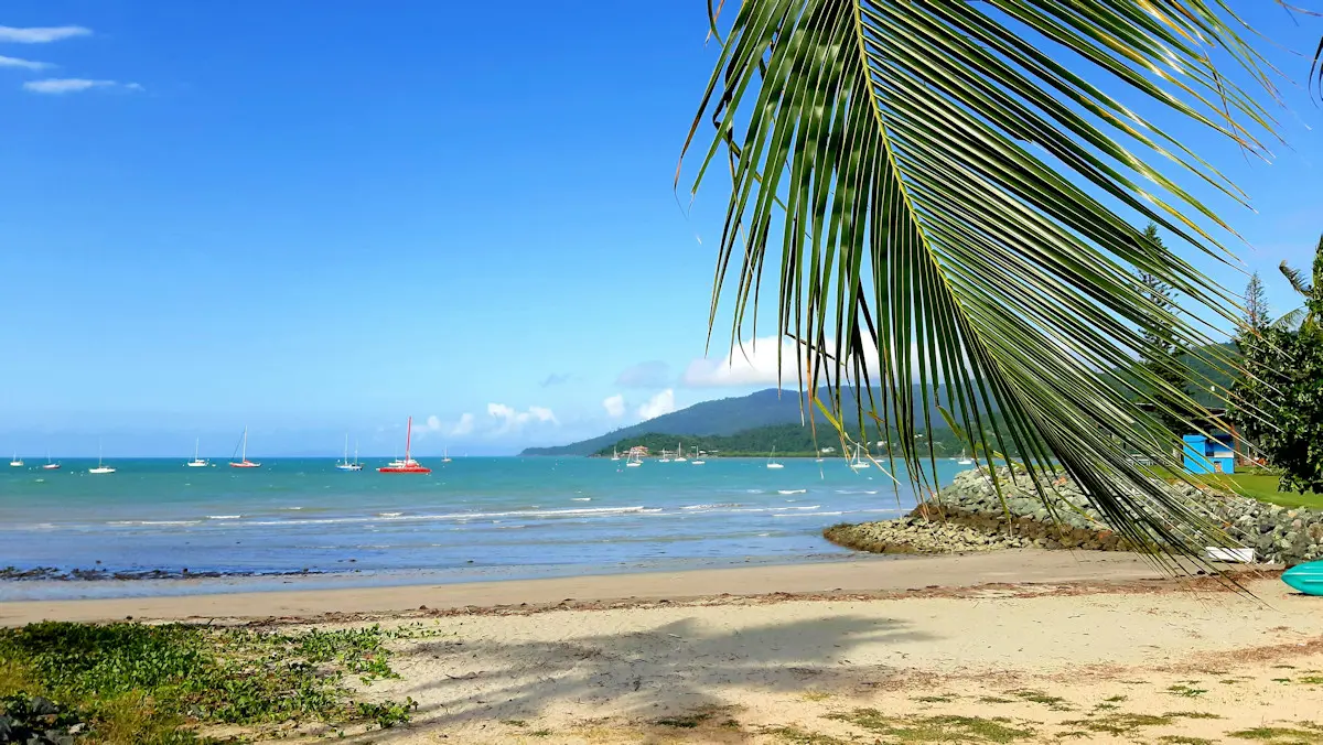 Looking out to sea and a headland on a sunny day at Airlie Beach