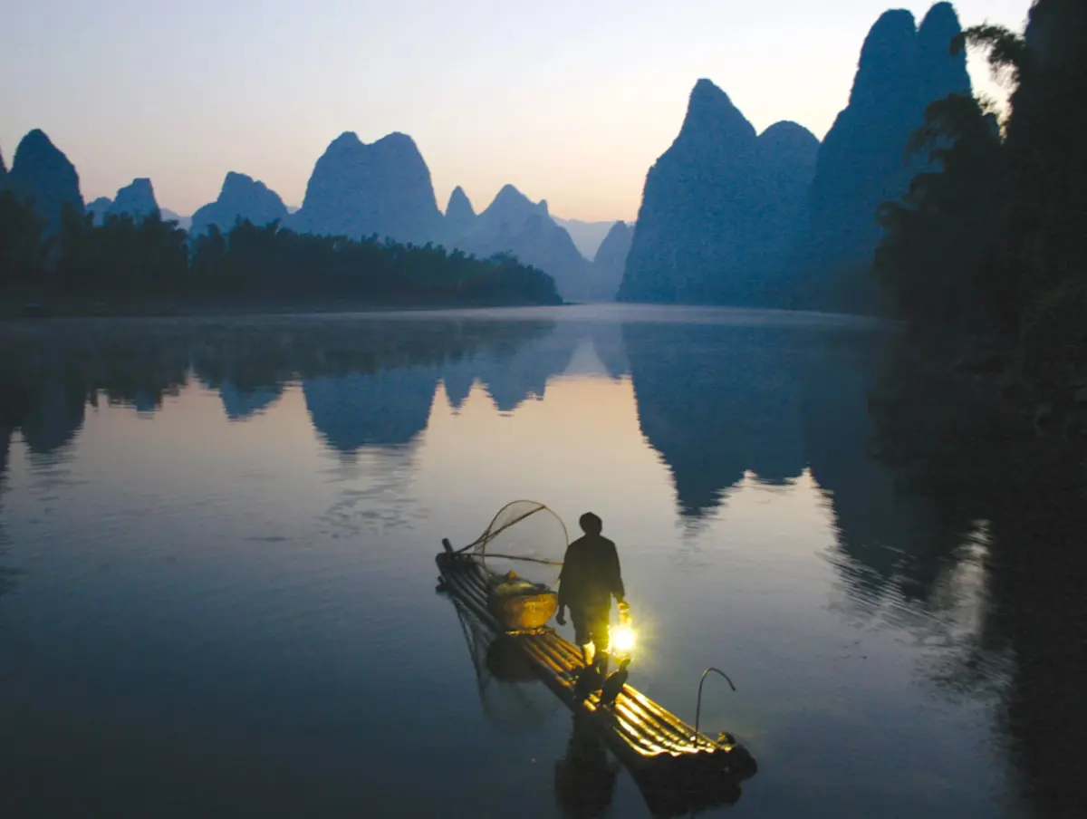 Image of a fisherman on the water at Guilin