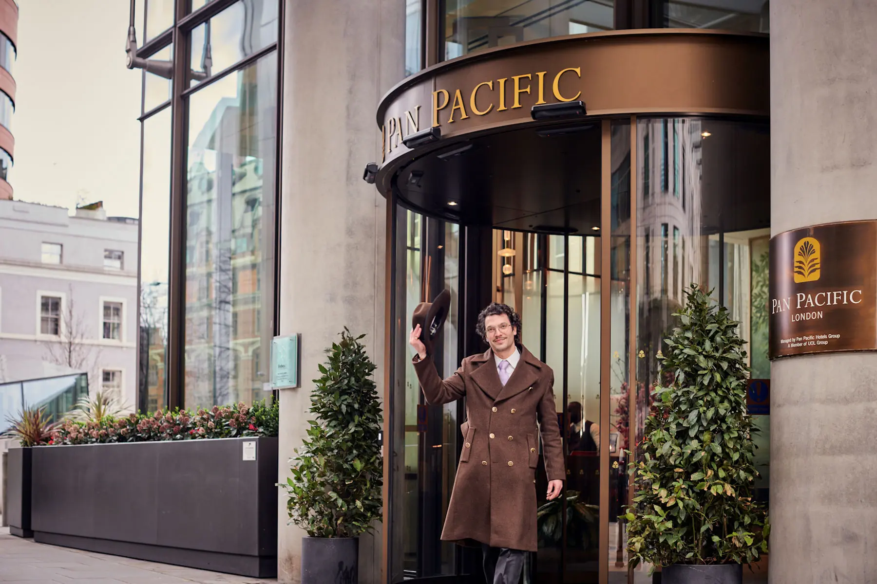 A member of the Pan Pacific London team welcomes guests to the hotel