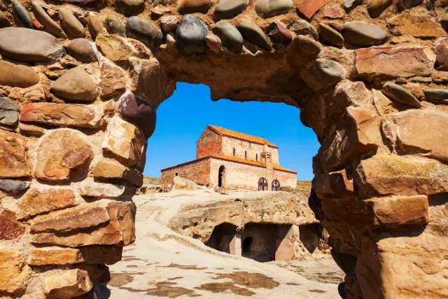 Image shows part of the cave city at cave city at Uplistsikhe