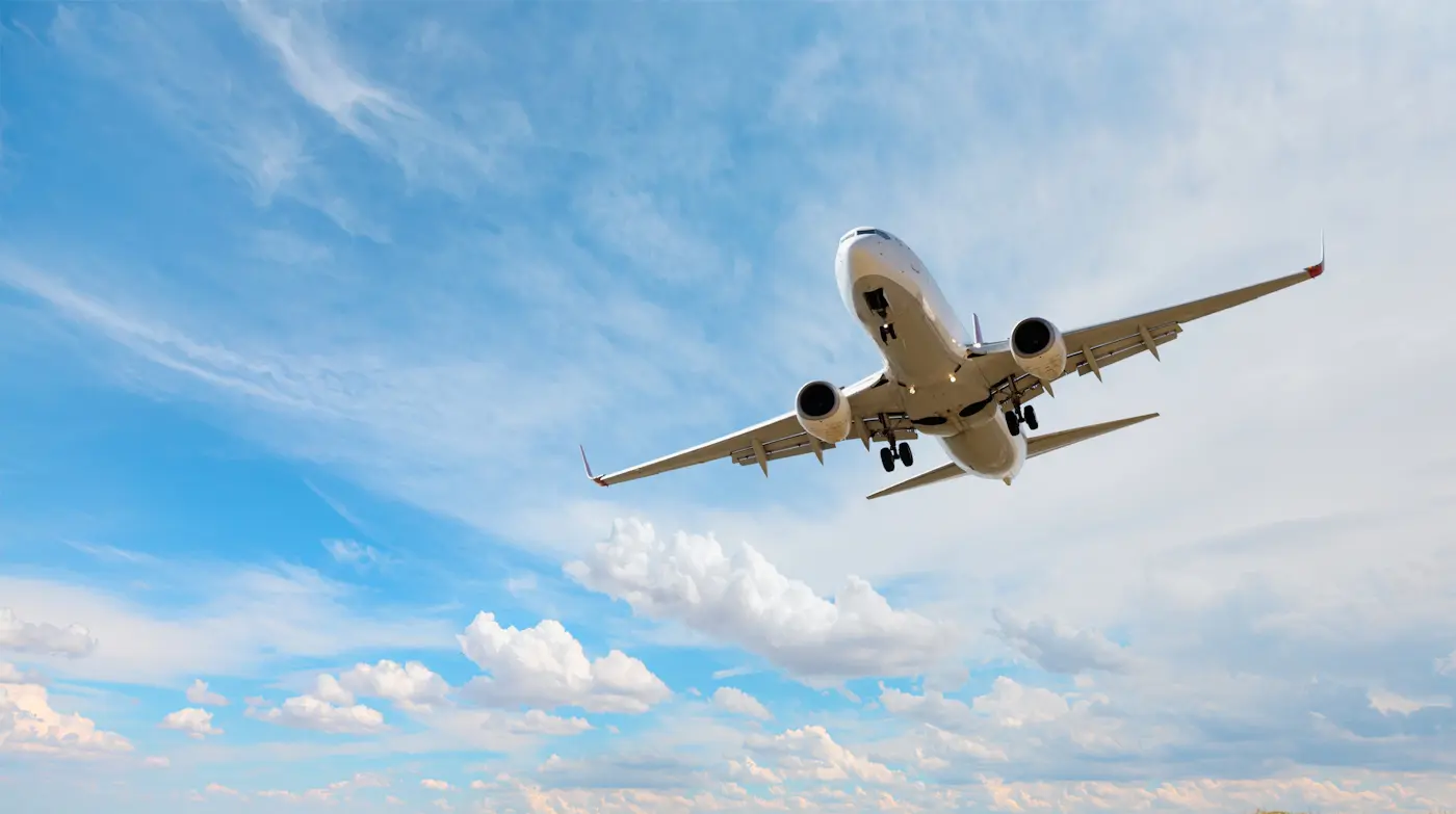 Image of an airliner set against a cloudy sky