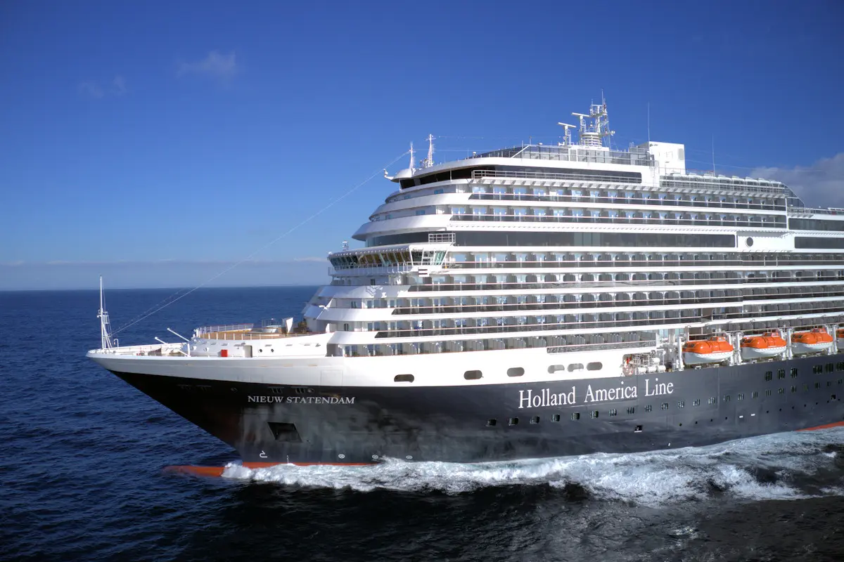 Image shows a port side view of the Holland America ship, Nieuw Statendam