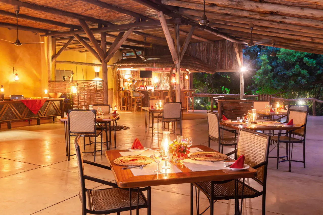 Night-time image of the restaurant at Leopard Walk Lodge